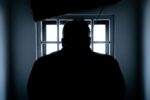 criminal in jail cell