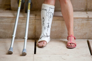 Milwaukee Personal Injury Lawyer- crutches with person with broken leg