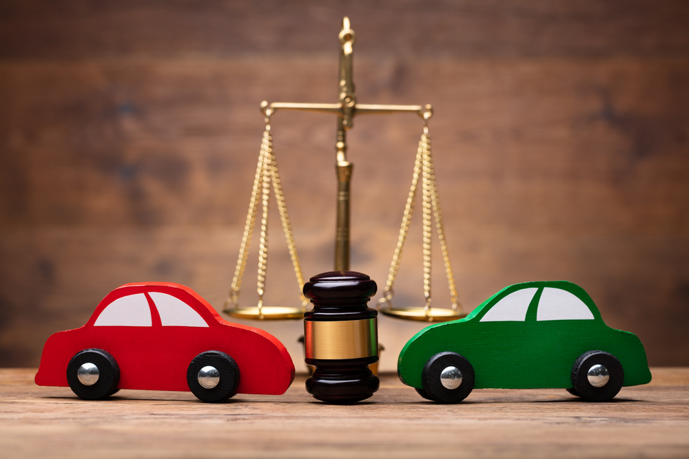 Hit & Run Accidents - Two Red And Green Car In Front Of Justice Scale