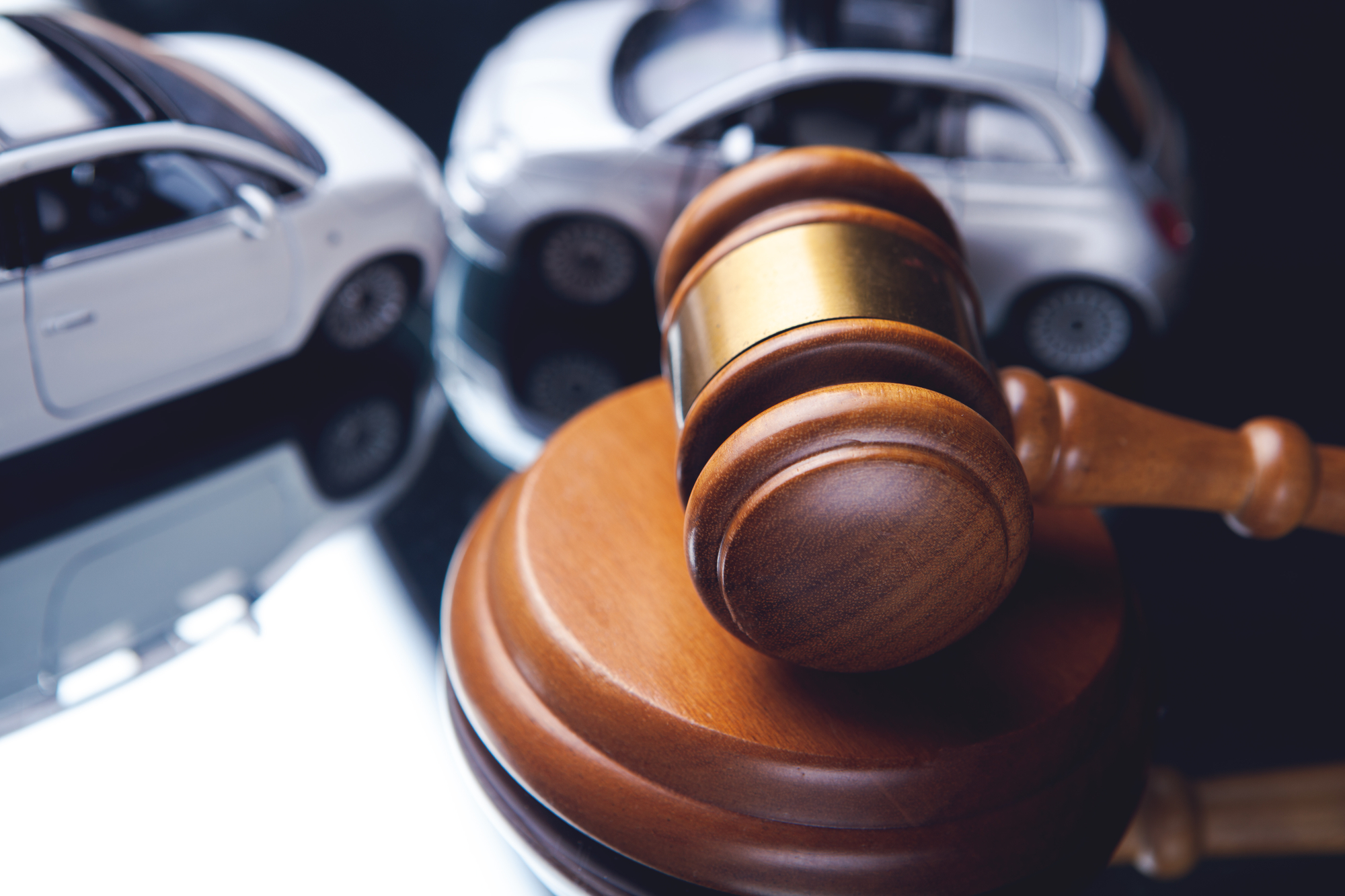 Sharing Information After An Accident - Model of car and gavel. Accident lawsuit or insurance, court case